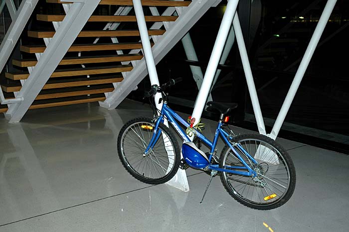 Photo of bike under stairs with flash