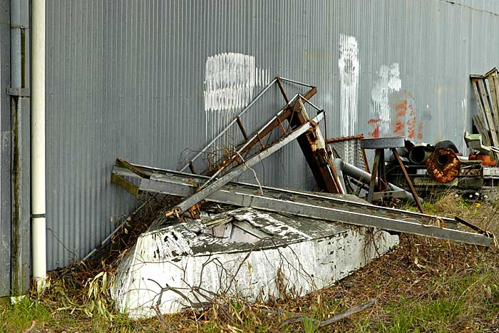 Upturned boat outside the building