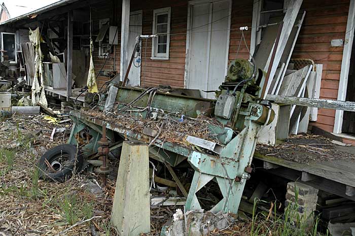The verandah has discarded junk around it